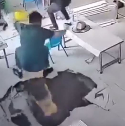 Incredible Feat of Balance: Man Defies Gravity as Sinkhole Opens Up in Restaurant!