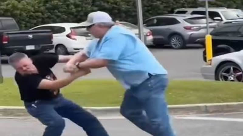2 Middle Aged Men Fight in the Parking Lot of a Shopping Center