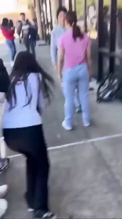 Girls Fight in Front of a Strip Mall