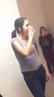 Girls in Jeans Fight in a Blue Bathroom