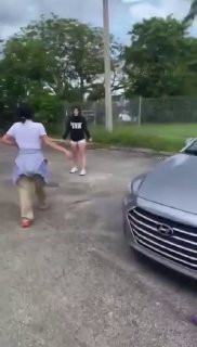 Girls Fight in a Parking Lot of a Park