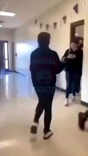 Girls in Black Sweaters Fight in the School Hallway
