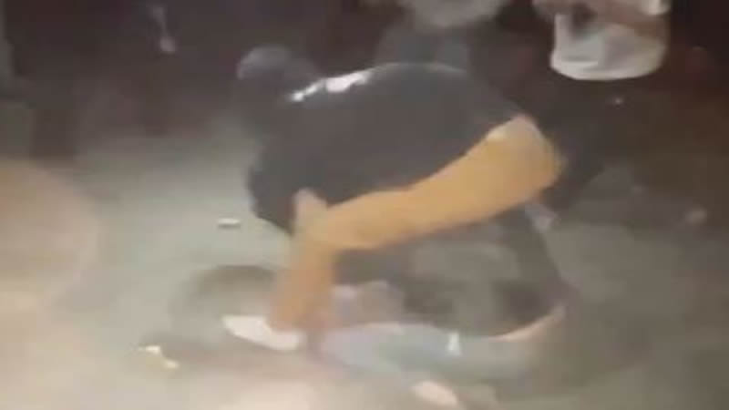 Girls in Hoodies Fight in the Rain